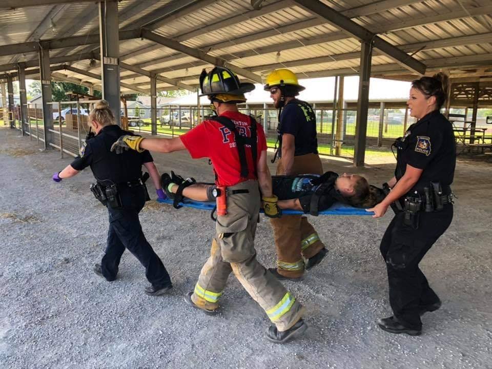 fire fighters and police officers rescue simulated patient